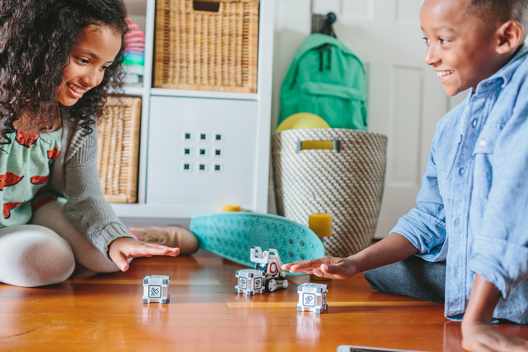 Kids play with Cozmo Robot made by toy company Anki in this lifestyle photoshoot by Leah Verwey