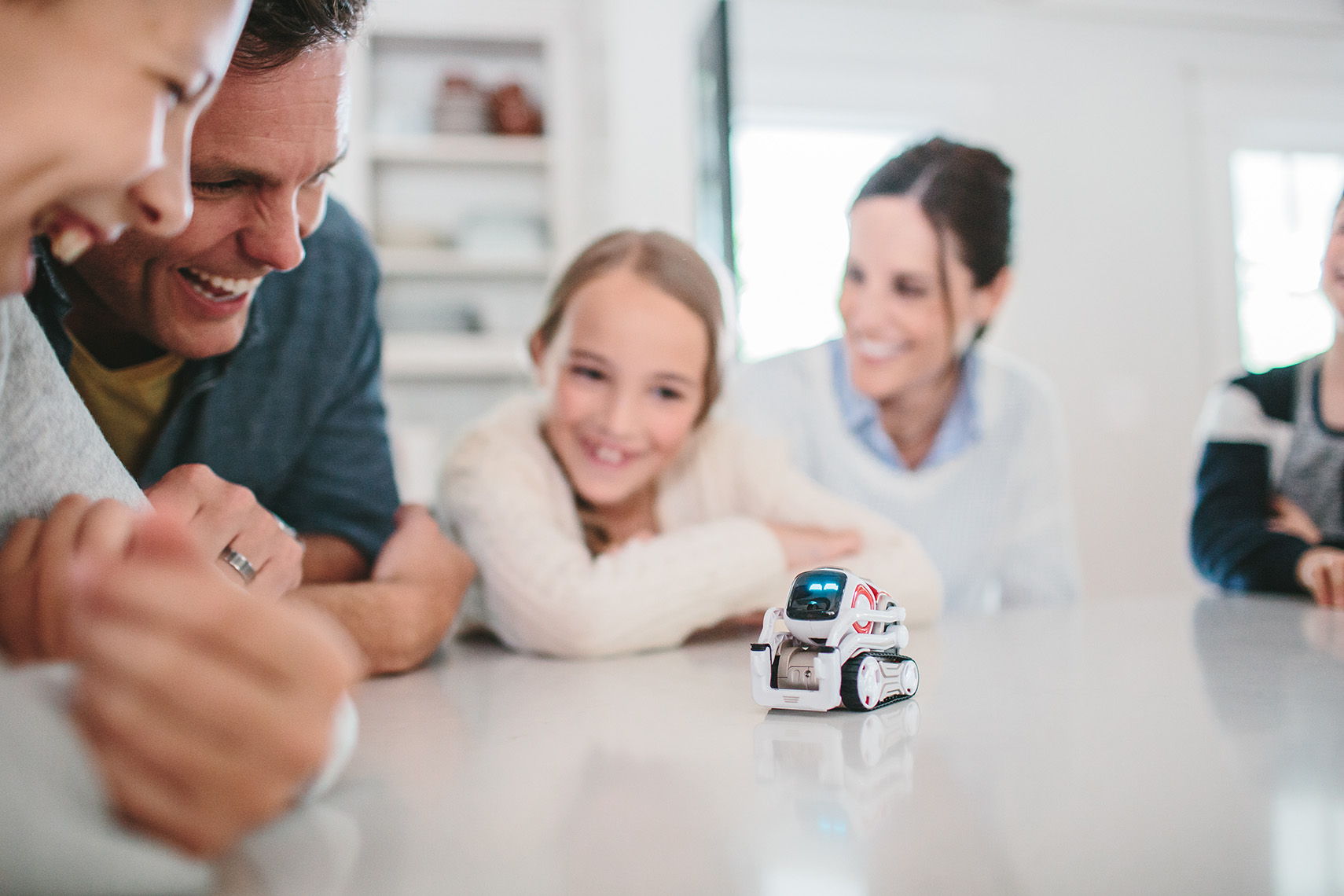 Family plays with Cozmo Robot by Anki. 